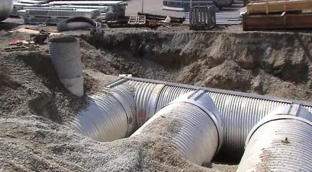 Corrugated steel pipe set in an excavated trench on a Shallenberger job