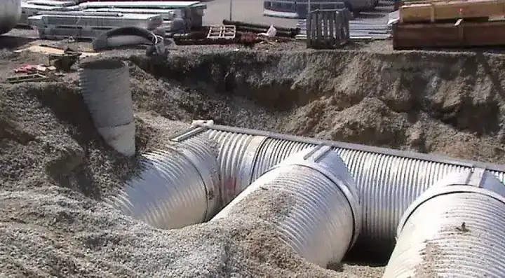 Corrugated steel pipe set in an excavated trench on a Shallenberger job