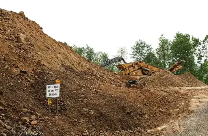 A spoil bank and screening plant on an open pit coal removal job